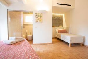 Posteľ alebo postele v izbe v ubytovaní Agriturismo Torre del Marino
