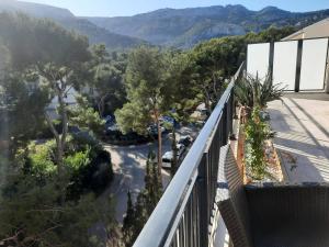 a balcony with a view of a park at TERRASSES PARC NATIONAL DES CALANQUES-SORMIOU in Marseille