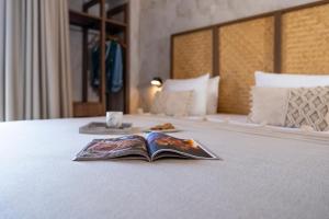 Postel nebo postele na pokoji v ubytování Oasis Hotel Prasonisi