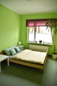 Posteľ alebo postele v izbe v ubytovaní Apartament Centrum