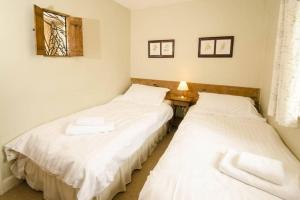 Katil atau katil-katil dalam bilik di Juniper Grasmere - Juniper Cottage, Grasmere