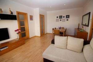 Televízia a/alebo spoločenská miestnosť v ubytovaní BONITO APARTAMENTO