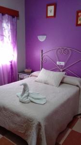 En eller flere senge i et værelse på Hostal Andalucia