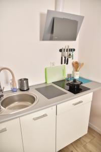 Kuchyňa alebo kuchynka v ubytovaní Apartament Centrum + 32 fotografií