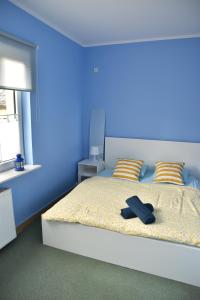 Posteľ alebo postele v izbe v ubytovaní Apartament Centrum