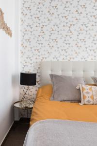A bed or beds in a room at Juan de Padilla Boutique by Nagoa Homes