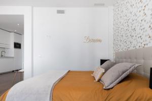 A bed or beds in a room at Juan de Padilla Boutique by Nagoa Homes