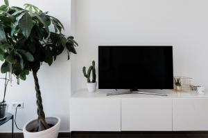 A television and/or entertainment centre at Juan de Padilla Boutique by Nagoa Homes
