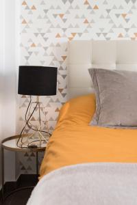A bed or beds in a room at Juan de Padilla Boutique by Nagoa Homes