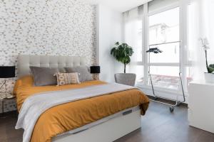 A bed or beds in a room at Juan de Padilla Boutique by Nagoa Homes