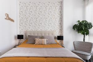 A bed or beds in a room at Juan de Padilla Boutique by Nagoa Homes