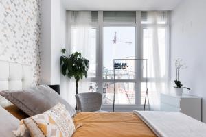 A bed or beds in a room at Juan de Padilla Boutique by Nagoa Homes