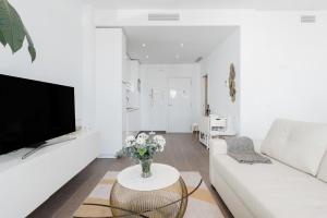 A television and/or entertainment centre at Juan de Padilla Boutique by Nagoa Homes