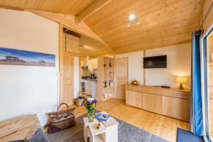 a living room with a couch and a table at Domaine de la Forge in La Teste-de-Buch