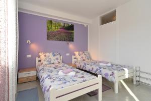 Postel nebo postele na pokoji v ubytování House Roza 2065