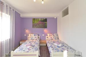 Postel nebo postele na pokoji v ubytování House Roza 2065