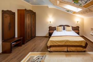 Кровать или кровати в номере Mini-Hotel Guest House Inn Lviv