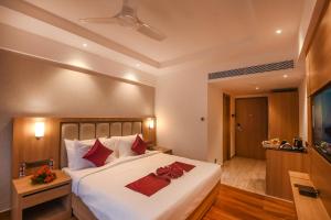 Emerald Clarks Inn Suites客房内的一张或多张床位
