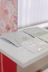 a magazine sitting on top of a white refrigerator at Versal Hotel in Maykop