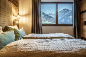 Postel nebo postele na pokoji v ubytování Chalets - The Peak