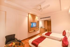 Emerald Clarks Inn Suites客房内的一张或多张床位