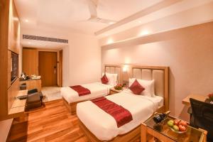 Emerald Clarks Inn Suites客房内的一张或多张床位