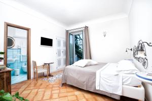 Postel nebo postele na pokoji v ubytování B&B Ercole di Amalfi