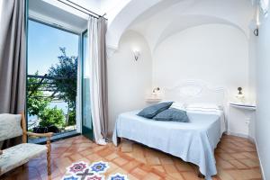 Postel nebo postele na pokoji v ubytování B&B Ercole di Amalfi