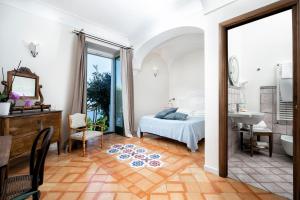 Postel nebo postele na pokoji v ubytování B&B Ercole di Amalfi