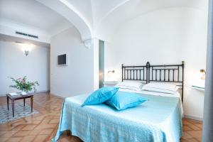 Postel nebo postele na pokoji v ubytování B&B Ercole di Amalfi