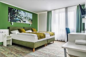 En eller flere senger på et rom på Hotel Atlantis