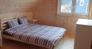 Postel nebo postele na pokoji v ubytování Ramlejowe Wzgórze - Sauna-Balia