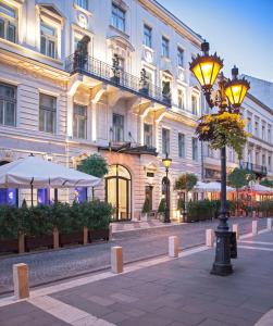 a street light in front of a building at Aria Hotel Budapest by Library Hotel Collection in Budapest