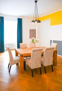 a dining room with a wooden table and chairs at Royal Residence Hofburg in Vienna