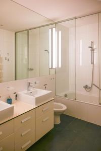 a bathroom with a sink and a toilet and a shower at Royal Residence Hofburg in Vienna