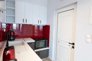 A kitchen or kitchenette at Eleftherias Suites