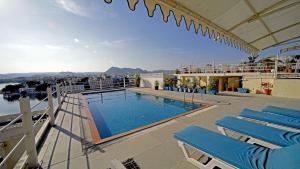 a swimming pool on the roof of a building at Udaigarh - Udaipur in Udaipur