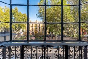 an open window with a view of a building at Casa Sevilla 1855 Suites by Época in Seville