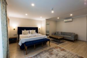 A bed or beds in a room at Florya Novi Hotel