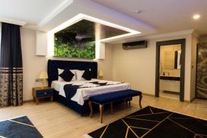 A bed or beds in a room at Florya Novi Hotel