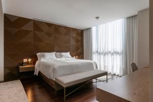 Postel nebo postele na pokoji v ubytování LK Design Hotel Florianópolis