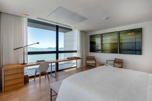 Postel nebo postele na pokoji v ubytování LK Design Hotel Florianópolis