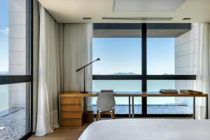 Postel nebo postele na pokoji v ubytování LK Design Hotel Florianópolis