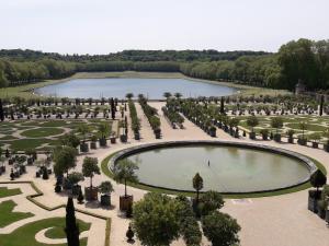 an aerial view of a garden with a pond at Le Petit Mansart in Versailles