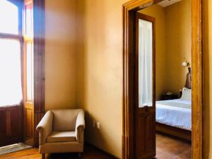 Postel nebo postele na pokoji v ubytování Hotel Boutique Casa de las Manrique