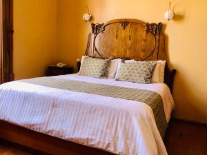 Postel nebo postele na pokoji v ubytování Hotel Boutique Casa de las Manrique