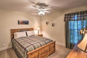 a bedroom with a bed and a ceiling fan at Blairsville Home with Deck and Stunning Mountain Views in Hood
