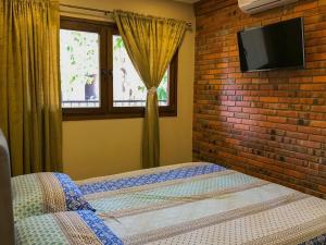 Postelja oz. postelje v sobi nastanitve Aparthotel Los Laureles
