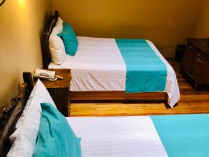 Postel nebo postele na pokoji v ubytování Hotel Boutique Casa de las Manrique