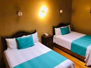Postel nebo postele na pokoji v ubytování Hotel Boutique Casa de las Manrique